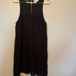 Sleeveless black pleated dress